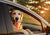 golden retriever with head and paws outside of passenger car window