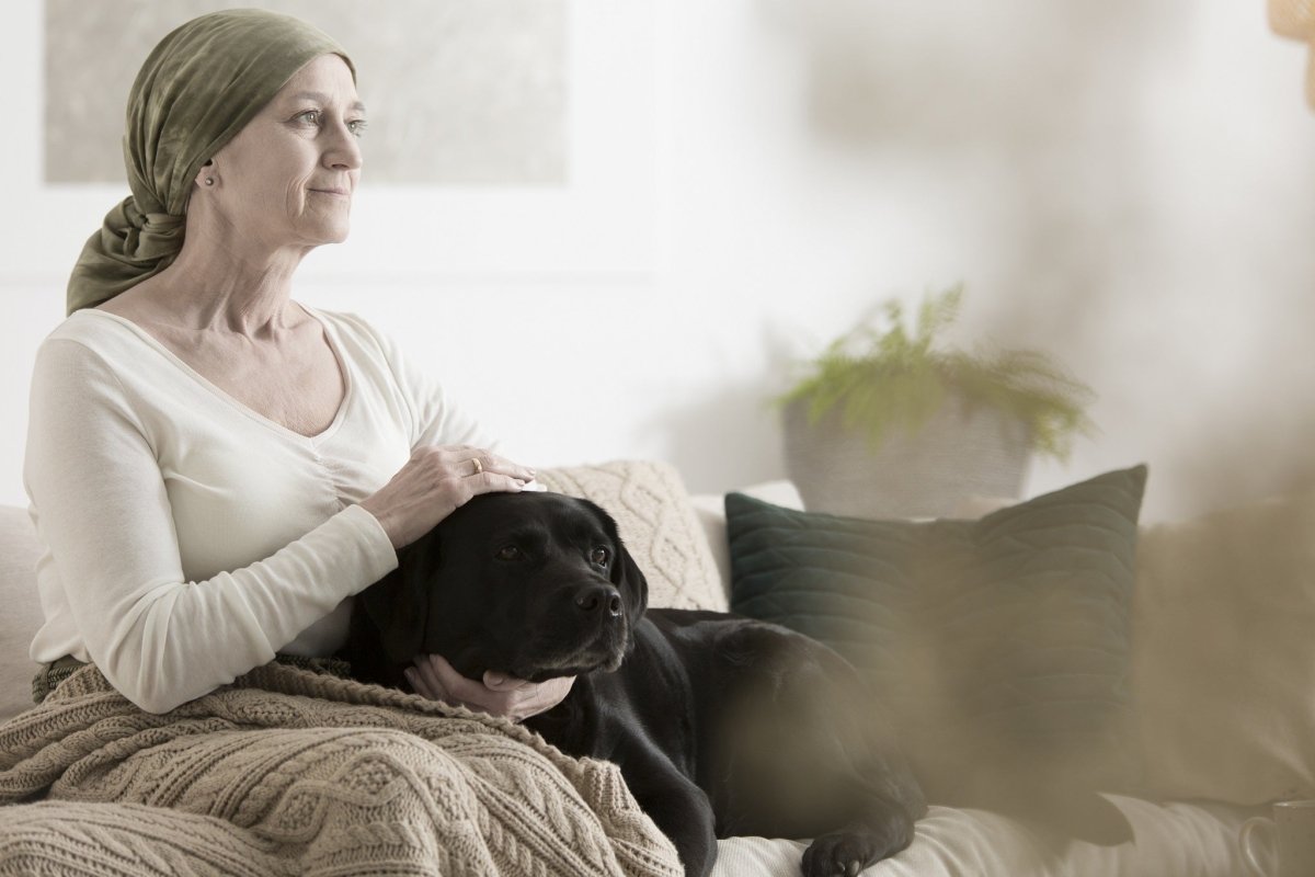 woman sitting with dog on her lap