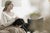 woman sitting with dog on her lap