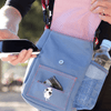 A person holding a Walkie Shoulder Bag - Light Blue from Best Bully Sticks and a cell phone.