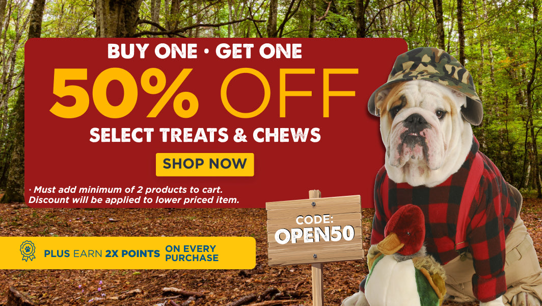 Promotional banner with a dog in a camouflage hat and plaid jacket, offering a 50% discount on treats and chews with code OPEN50. Must add 2 items to cart, discount applied to lower priced item. 2X Points on every purchase.
