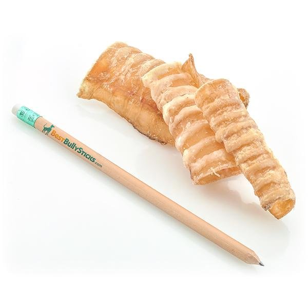 A Beef Trachea Grab Bag (8 oz) by Best Bully Sticks next to a piece of bread.