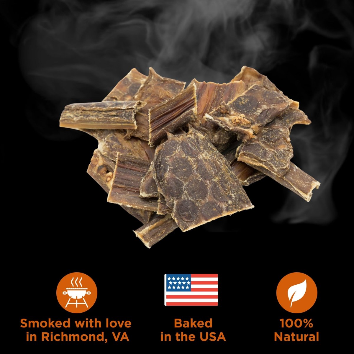 A pile of Best Bully Sticks Hickory Smoked Beef Jerky Gullet Bites with smoke rising above, plus icons showing they are smoked in Richmond, VA, baked in the USA, and made from 100% natural ingredients.