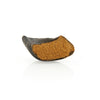A piece of Sweet Potato Stuffed Hoof from Best Bully Sticks is sitting on top of a white surface.