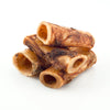A pile of Best Bully Sticks BB 2-3 Inch Natural Femur Bone 4pk on a white background.